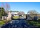 A gated entrance with stone pillars and wrought iron fencing that provides both security and curb appeal to the property at 1615 Stack Rd, Monroe, NC 28112