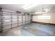 Spacious garage with ample storage, a rolling door, and work space at 1615 Stack Rd, Monroe, NC 28112