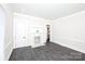 Bright living room featuring a classic fireplace, wainscoting, and sleek wood floors at 1615 Stack Rd, Monroe, NC 28112