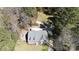 An aerial view of a house with a long driveway surrounded by lush trees, showcasing its secluded setting at 1717 Deer Run Rd, Catawba, SC 29704