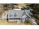 Aerial view of a home showing its unique roofline, stone accents, and a well-manicured front yard at 1717 Deer Run Rd, Catawba, SC 29704