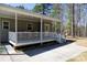 Spacious back porch, perfect for outdoor entertaining, with string lights and a built-in play area at 1717 Deer Run Rd, Catawba, SC 29704