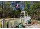 Charming backyard with arbor, white picket fence, and lush greenery, offering a serene outdoor space at 1717 Deer Run Rd, Catawba, SC 29704