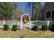 Charming backyard with white fence, arbor, and a cozy wooden swing for relaxation at 1717 Deer Run Rd, Catawba, SC 29704