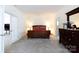 Relaxing main bedroom with a large bed, neutral carpet, and easy access to the bathroom at 1717 Deer Run Rd, Catawba, SC 29704