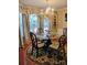 Elegant dining room featuring a chandelier, decorative rug and wooden chairs at 1912 Darbywine Dr, Charlotte, NC 28216