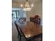 Stylish dining room with a chandelier, wood table, and comfortable chairs at 1912 Darbywine Dr, Charlotte, NC 28216