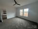 A carpeted bedroom with large windows and a ceiling fan at 2070 Travis Rd, Conover, NC 28613