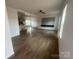 Spacious living room featuring wood flooring and open kitchen concept at 2070 Travis Rd, Conover, NC 28613