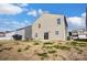 Backyard view of a home with vinyl siding, features a patio and a spacious yard with a clear blue sky at 2135 Eastway Dr, Dallas, NC 28034