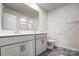 Bright bathroom featuring a double sink vanity with modern fixtures and a large mirror at 2135 Eastway Dr, Dallas, NC 28034