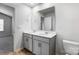 Stylish bathroom featuring a double vanity with contemporary fixtures and a large mirror at 2135 Eastway Dr, Dallas, NC 28034