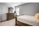 Bedroom showcases a wooden dresser, neutral walls and natural light; it's a simple, welcoming space for relaxation at 2135 Eastway Dr, Dallas, NC 28034