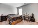 Bedroom featuring neutral walls, a comfortable bed, and a functional desk space, ideal for a cozy and productive room at 2135 Eastway Dr, Dallas, NC 28034