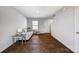 Bright living room with hardwood floors, neutral colors, and a large window at 2135 Eastway Dr, Dallas, NC 28034