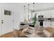 Contemporary kitchen features white cabinets, modern lighting, and stainless steel appliances for a sleek, upscale design at 2544 Pinestream Dr, Charlotte, NC 28216