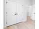 Spacious closet with double doors and hardwood floors, located near entry doors at 2544 Pinestream Dr, Charlotte, NC 28216