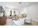 Modern living room with neutral tones, a large window, and an open floor plan to the dining area at 2544 Pinestream Dr, Charlotte, NC 28216