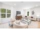 Inviting living room with comfortable seating, a modern entertainment center, and large windows at 2544 Pinestream Dr, Charlotte, NC 28216