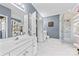 Modern bathroom with dual vanities, a glass-enclosed shower, and elegant finishes at 2604 Lamplighter Dr, Kannapolis, NC 28081