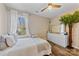 Bright bedroom featuring a large window, white walls, and neutral decor at 2604 Lamplighter Dr, Kannapolis, NC 28081