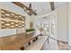 Bright dining room featuring wood beams, a decorative chandelier, and an elegant bay window at 2604 Lamplighter Dr, Kannapolis, NC 28081