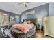 A modern main bedroom featuring unique round bed, decorative furniture and a ceiling fan at 2604 Lamplighter Dr, Kannapolis, NC 28081