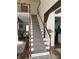 Elegant staircase with wood and white accents, leading to the upper level of the home at 2604 Lamplighter Dr, Kannapolis, NC 28081