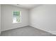 Bedroom features a window and neutral carpeting at 3044 Ora Smith Rd, Lincolnton, NC 28092