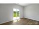 Bright, empty bedroom with sliding glass door, offering access to a private backyard at 3044 Ora Smith Rd, Lincolnton, NC 28092