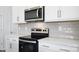 Close up of a modern kitchen featuring stainless steel appliances and sleek countertops at 3044 Ora Smith Rd, Lincolnton, NC 28092