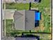 An aerial view showing the house, backyard and patio featuring a blue sunshade, patio with outdoor seating and play equipment at 3426 Dominion Green Dr, Charlotte, NC 28269