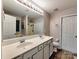 Bright bathroom featuring double sinks, large mirror, and separate shower and tub at 3426 Dominion Green Dr, Charlotte, NC 28269