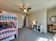 bedroom with bunkbeds, plenty of space to play and a ceiling fan at 3426 Dominion Green Dr, Charlotte, NC 28269