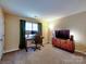 A bedroom with lots of space, a ceiling fan and a desk set at 3426 Dominion Green Dr, Charlotte, NC 28269