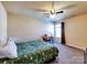 Bedroom with ceiling fan, carpeted floor, window, dresser, and desk to the right of the bed at 3426 Dominion Green Dr, Charlotte, NC 28269