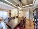 Dining area with hardwood floors, modern lighting, and ample space for entertaining at 3426 Dominion Green Dr, Charlotte, NC 28269