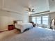 Spacious main bedroom with large windows, plush carpeting, and a ceiling fan for ultimate comfort at 3426 Dominion Green Dr, Charlotte, NC 28269