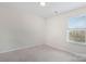 Bright bedroom with a window view of mature trees, plush carpeting, and neutral walls, a calm retreat at 353 Webb Farm Rd, Shelby, NC 28152