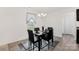 Cozy dining area with modern chandelier, seating for four, and elegant decor at 353 Webb Farm Rd, Shelby, NC 28152