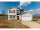 Inviting two-story home with red shutters, well-kept lawn, and attached two-car garage at 353 Webb Farm Rd, Shelby, NC 28152