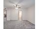 Bedroom with plush carpeting, white walls, and ceiling fan with connections to the rest of the house at 40701 Nc 740 Hwy, New London, NC 28127