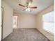 Bedroom features neutral walls, plush carpet, ceiling fan and a window for natural light at 40701 Nc 740 Hwy, New London, NC 28127