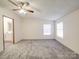 Bedroom with a neutral color scheme, soft carpeting, and natural light from the windows at 40701 Nc 740 Hwy, New London, NC 28127