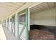 Horse barn with green and white trim and stalls, perfect for equestrian enthusiasts at 447 Willow Pond Ln, Hiddenite, NC 28636