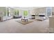 Large bedroom with lots of natural light, large windows, and two beds at 447 Willow Pond Ln, Hiddenite, NC 28636