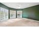 Bedroom with white trim and large windows at 447 Willow Pond Ln, Hiddenite, NC 28636
