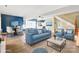 Cozy living room with bright blue furniture and stylish decor at 447 Willow Pond Ln, Hiddenite, NC 28636