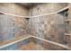 Walk-in shower with bench and multiple shower heads at 447 Willow Pond Ln, Hiddenite, NC 28636