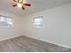 This bedroom offers natural light and hardwood floors at 4601 Mendham Dr, Charlotte, NC 28215